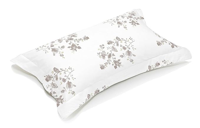 Brown and white pillow with floral patterns 