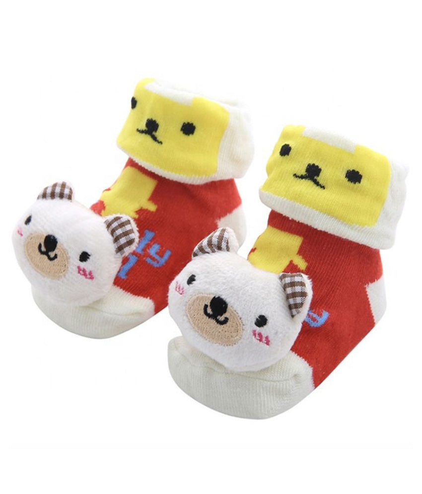 Pair of baby socks with cartoon face design