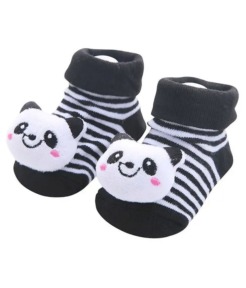 Pair of black and white striped baby socks with panda face design